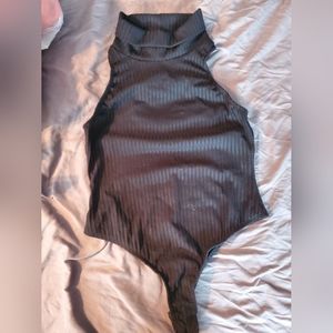Black turtle neck body suit